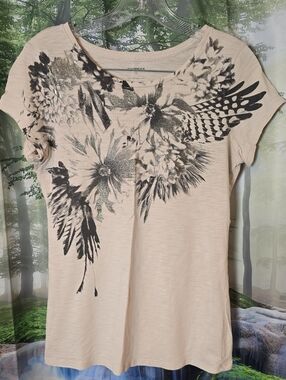 Express Cream Short Sleeve Tee with Black Floral Wing Print and Metallic Accents